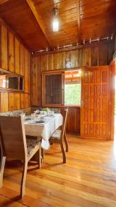 a large dining room with a table and chairs at Casa hotel in Barra do Guarita