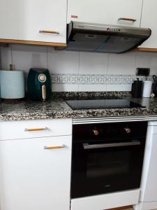 A kitchen or kitchenette at Sellamante2