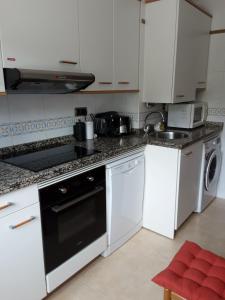 A kitchen or kitchenette at Sellamante2 Még 19 kép
