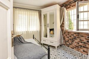 TV a/nebo společenská místnost v ubytování Lunaria Guest House