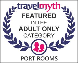 un segno che indica che il viaggiatore è stato compiuto nella categoria per soli adulti di Port Rooms a Limenas