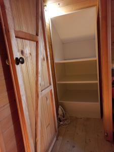 a room with a door and a closet at KaSper River House in Ledine