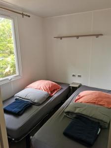 Postel nebo postele na pokoji v ubytování mobilhome 29