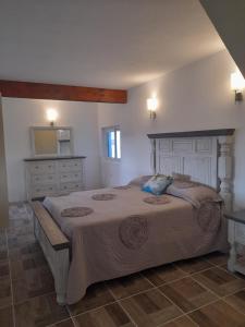 a bedroom with a large bed and a mirror at BAJA SUITES UPSTAIRS in Punta Abreojos +23 photos