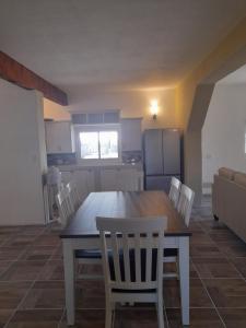 a dining room table and chairs in a kitchen at BAJA SUITES UPSTAIRS in Punta Abreojos