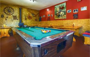 a room with a pool table in it at Amazing Apartment In Ostrvica With Jacuzzi in Ostrvica