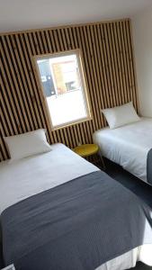 Кровать или кровати в номере CABAÑAS PAMPAS AUSTRALES