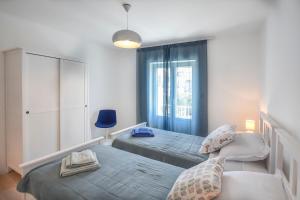 Postel nebo postele na pokoji v ubytování Apartment Filomena