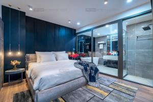a bedroom with a large bed and a bathroom at ELITE HOME in Tuy Hoa