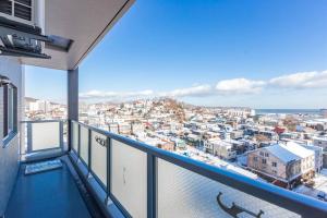 a balcony with a view of a city at GLOW in Otaru