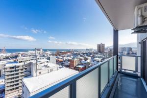 an apartment balcony with a view of a city at GLITTER in Otaru