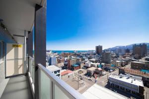 a view of a city from the balcony of a building at GIFT in Otaru