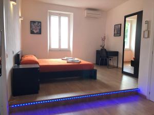 A bed or beds in a room at Harmony Affittacamere