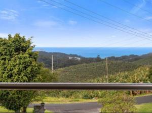 a view of the ocean from a car window at Ocean View Oasis, Coffs Harbour in Coffs Harbour