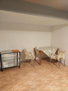 a dining room with a glass table and chairs at KALIFORNIA CENTRAL in Alicante