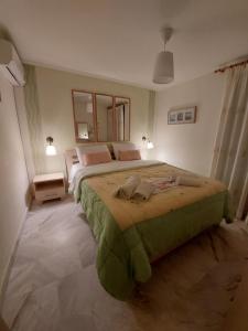 Postel nebo postele na pokoji v ubytování Nefeli Seaside Apartments