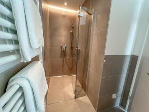 a shower with a glass door in a bathroom at Apartment Baska, exklusive Apartments mit Poolarea in Baska, Krk - Kroatien in Baška