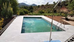 a swimming pool in a yard at Casa frari in Peralta de la Sal