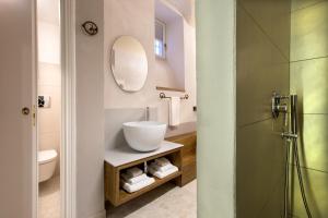 a bathroom with a sink and a mirror at Dimora del Leone Gaeta in Gaeta