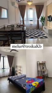 Voodi või voodid majutusasutuse Lovely 2-BR service apartment with pool (melur @ troikaKB) toas