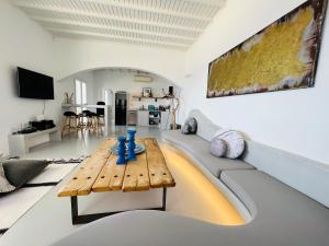 A television and/or entertainment centre at Yalos mykonos 3 bedroom Luxury home in Mykonos Town with Sea & Sunset view