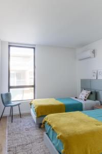 Posteľ alebo postele v izbe v ubytovaní Sun&Sea Luxury Apartment by MP