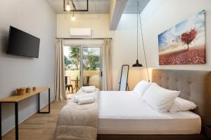 Uma cama ou camas num quarto em Senses Suites
