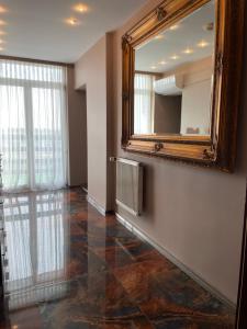 a room with a mirror and a tiled floor at Gościniec Raciborski in Racibórz