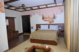 Ένα ή περισσότερα κρεβάτια σε δωμάτιο στο Mayisyan Kamurj Hotel