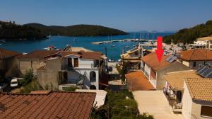 a view of a harbor with boats in the water at Τrilogy Studios in Syvota