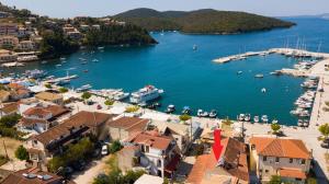 an aerial view of a harbor with boats in the water at Τrilogy Studios in Syvota