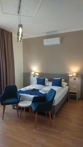 Postel nebo postele na pokoji v ubytování Hotel Napsugár