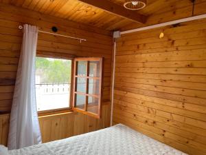Posteľ alebo postele v izbe v ubytovaní Agradable Mini Casa de madera con jardín amplio