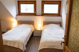 Łóżko lub łóżka w pokoju w obiekcie Appartement Haus Kruschitz II