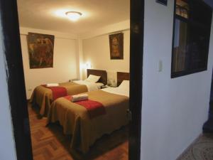 Katil atau katil-katil dalam bilik di Hotel Montecristo Cusco
