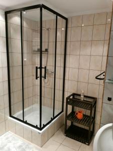 a shower with a glass enclosure in a bathroom at MARINKA Grzybowo in Grzybowo +46 photos