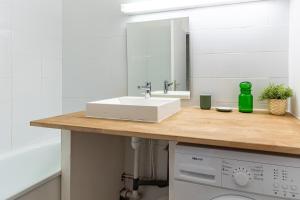 a bathroom counter with a sink and a mirror at TERRE MARINE - Bel appartement avec terrasse vue mer in Cassis