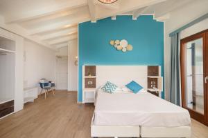 Postel nebo postele na pokoji v ubytování I Ginepri Hotel