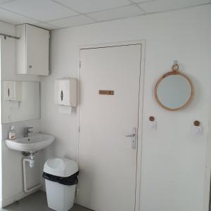 a bathroom with a toilet and a sink at Chambre Aliénor d'Aquitaine in Bordeaux