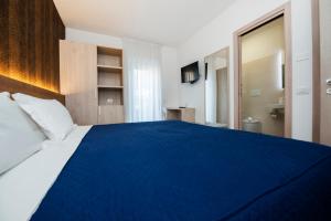 Postel nebo postele na pokoji v ubytování Gu Hotel