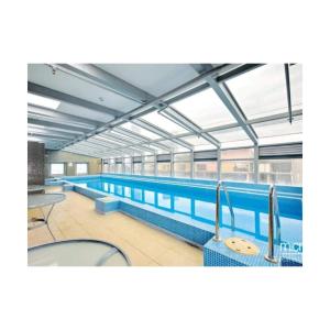 a large swimming pool in a building at Lovely apartment in Melbourne