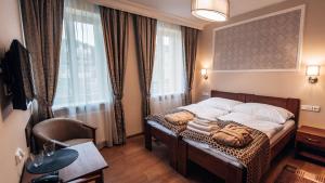 Postel nebo postele na pokoji v ubytování Star Hotel + 32 fotografií