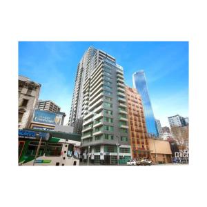a tall building in the middle of a city at Lovely apartment in Melbourne