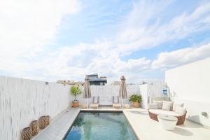 a swimming pool on the roof of a house at Ma Maison No5 Penthouse Loft, Private Heated Pool, Acropolis view, Ultra high speed Internet 300 Mbps, Short walk to Acropolis, Parking upon request, 1' from metro in Athens