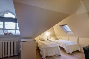 Postel nebo postele na pokoji v ubytování Snorri's Guesthouse