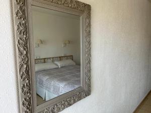 Postel nebo postele na pokoji v ubytování Hostal Roberto