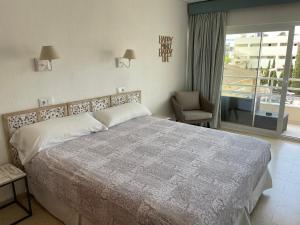 Postel nebo postele na pokoji v ubytování Hostal Roberto