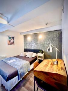 Postel nebo postele na pokoji v ubytování Hôtel Paul Riquet
