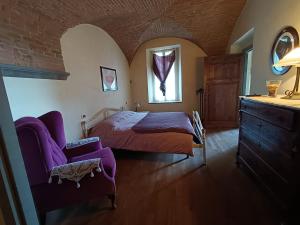 Villa Il Poggiale tesisinde bir odada yatak veya yataklar