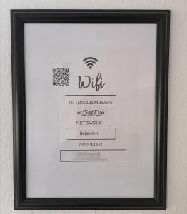 a framed picture of a certificate in a picture frame at RELAX INN - Messe contactless check in in Hannover